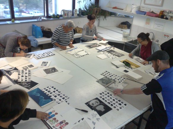 Custom Printing students work on their group project - artist book